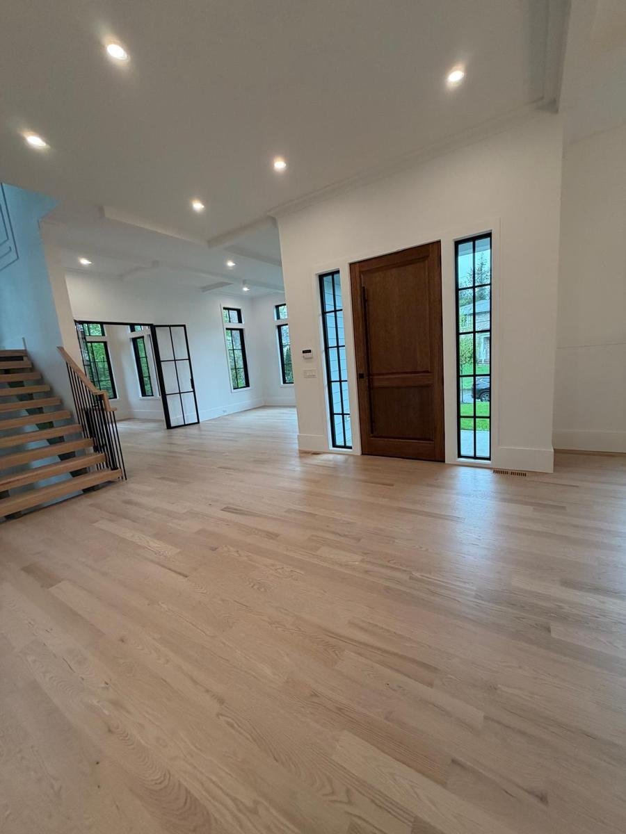 Foyer & oak stair: post-construction cleaning by JF Spotless in Westchester County NY